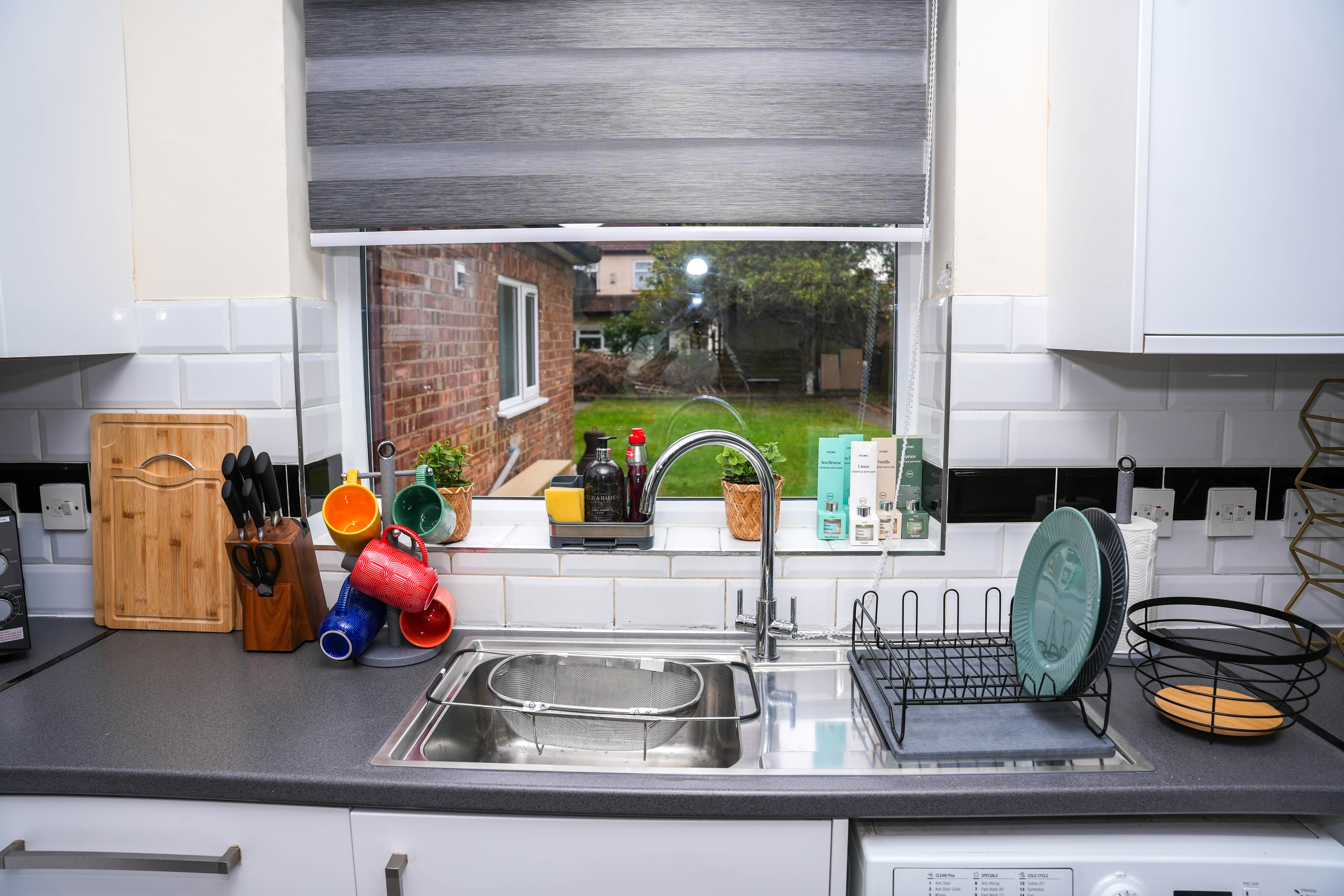 Kitchen sink with garden view at the Hounslow 4-Bedroom Home